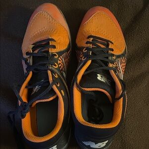 New Balance Men’s Orange and Black Men’s metal baseball cleats size 12.5